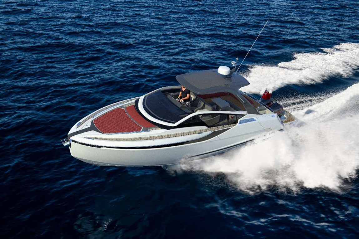 Luxury motorboat speeding across deep blue ocean with a man at the helm, leaving a wake behind.